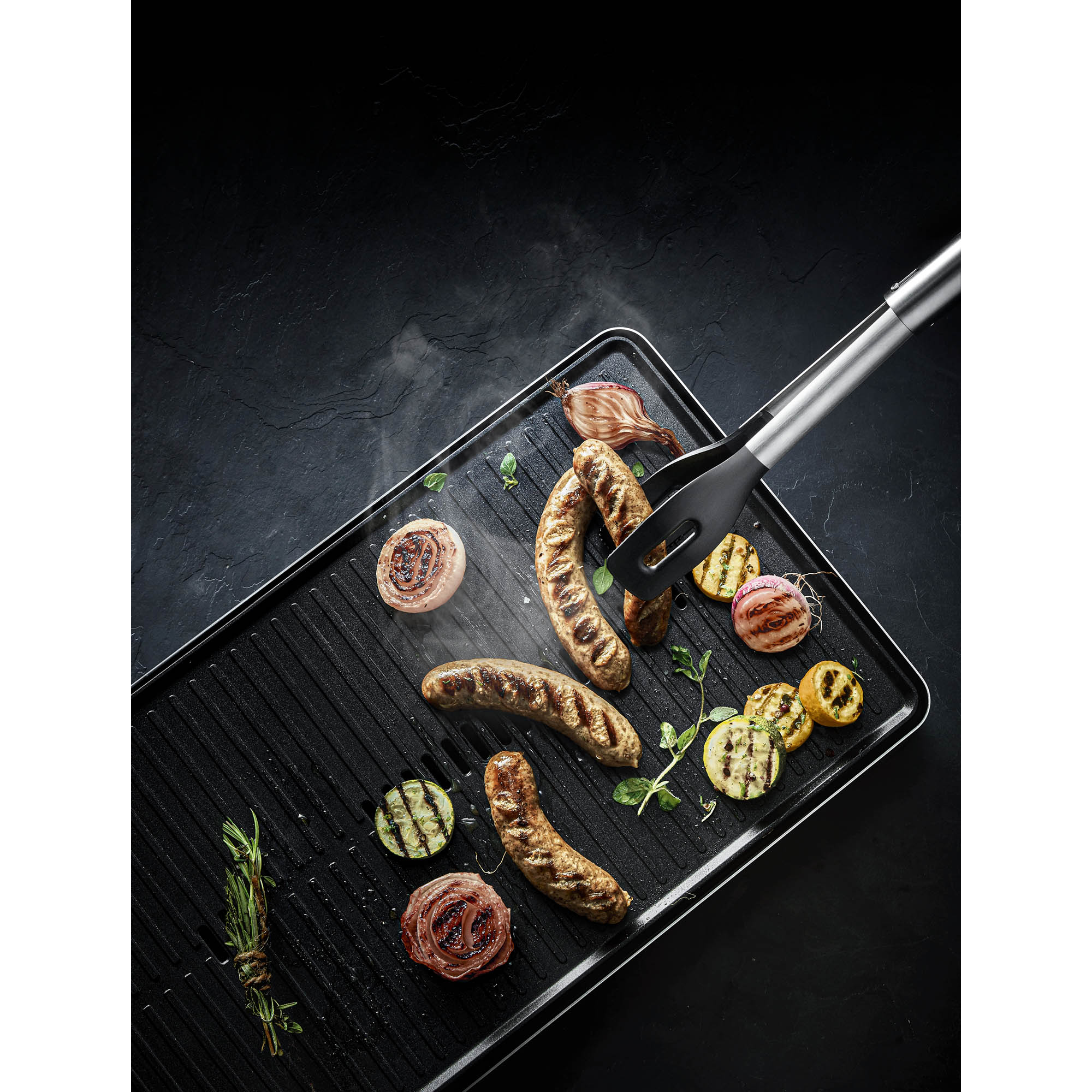 WMF Profi Plus serving tongs in Cromargan 18/10 with plastic gripping surfaces